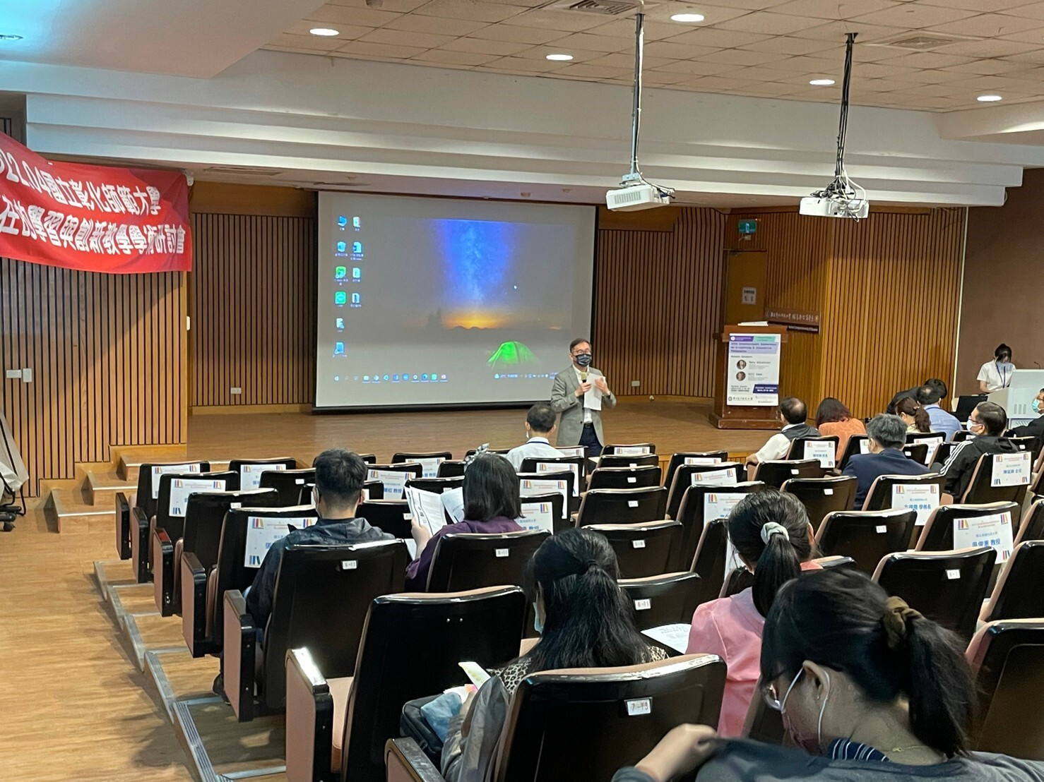 Figure 10. Professor Tsung-Chain Huang, the dean of the College of Education, delivering a speech