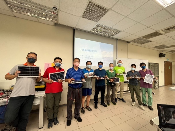 Figure 6. Image caption: Group photo of participants with their finished products