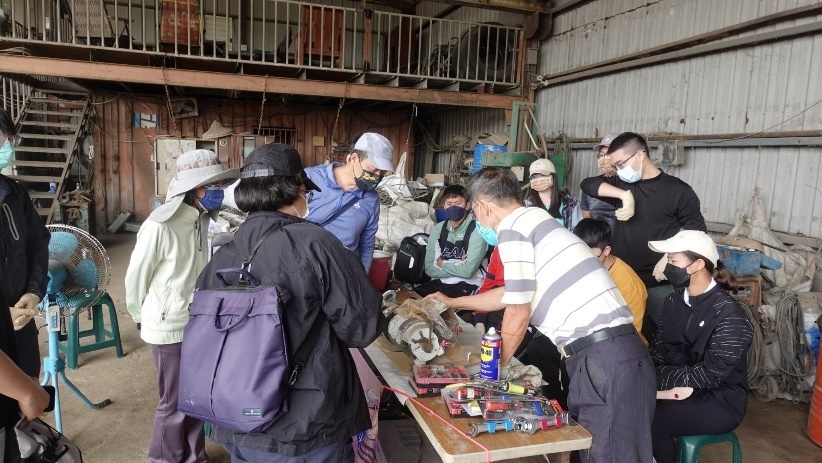 Figure 2. Participants learning household appliance servicing at a recycling site