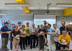 Caption: Group photo of participants with their projects