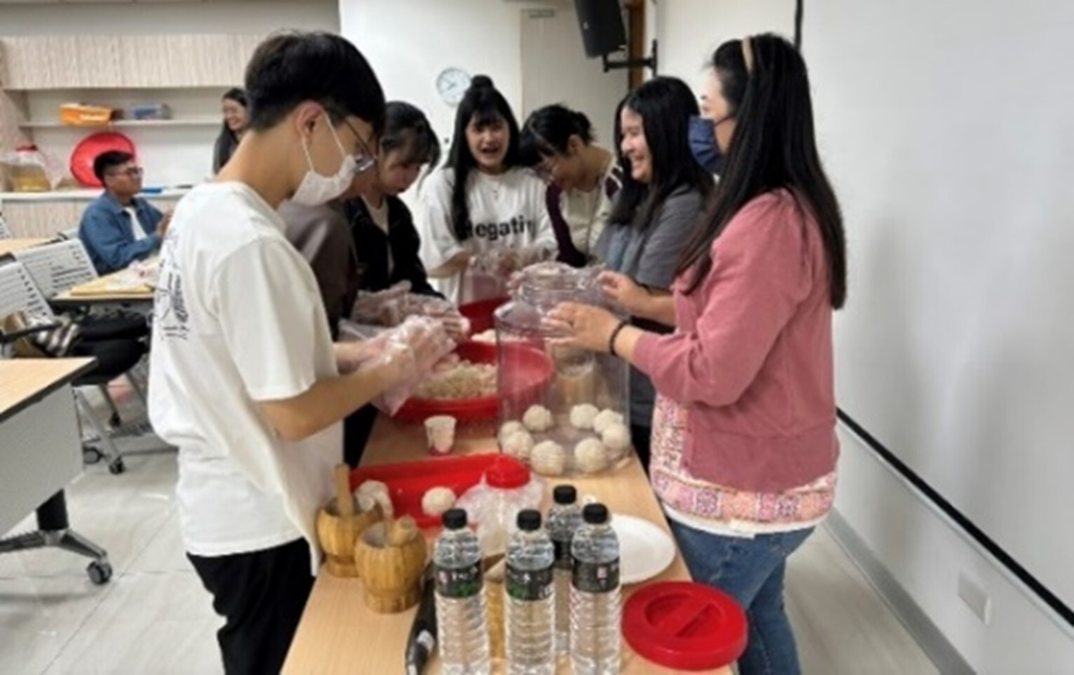 Figure 6: Students learning the traditional brewing process