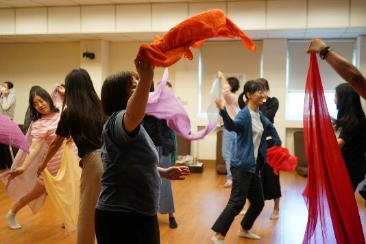 Figure12: Participants Using Scarves for Mirroring Practice