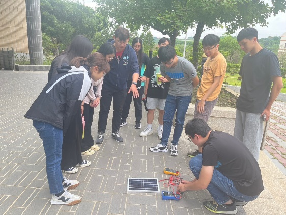 Figure 11. Teacher Leading Students in Solar Power Generation Training