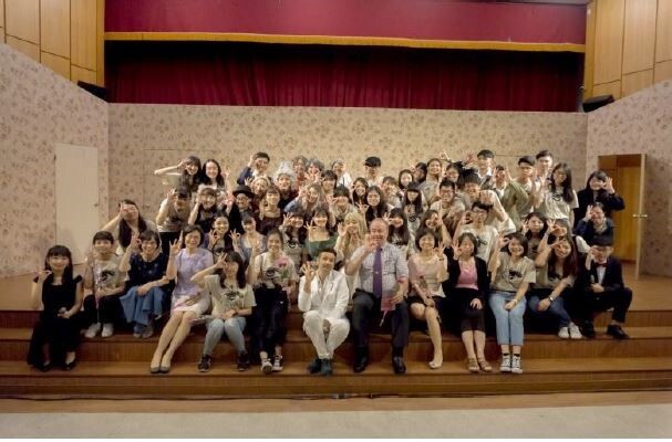 A group photograph of a drama performance by the teachers and students of Grade 2021